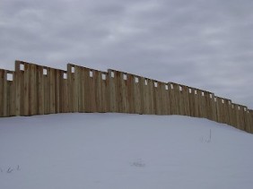 Wood Fence on Snowy Hill