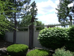 Wood Fence with Stone Pillars