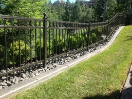 Iron Fence on Stone Bed
